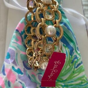 Lilly Pulitzer, gold and gemstone bangle bracelet with pouch